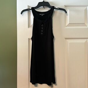 Sleeveless black top with silver on the chest. Size medium